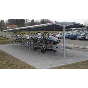 https://www.techni-contact.ovh/ressources/images/produits/merchandising/abri-velo-a-toiture-modulaire-3386681-1.jpg - Portée : 5,50 m - Hauteur des poteaux : jusqu'à 4 m